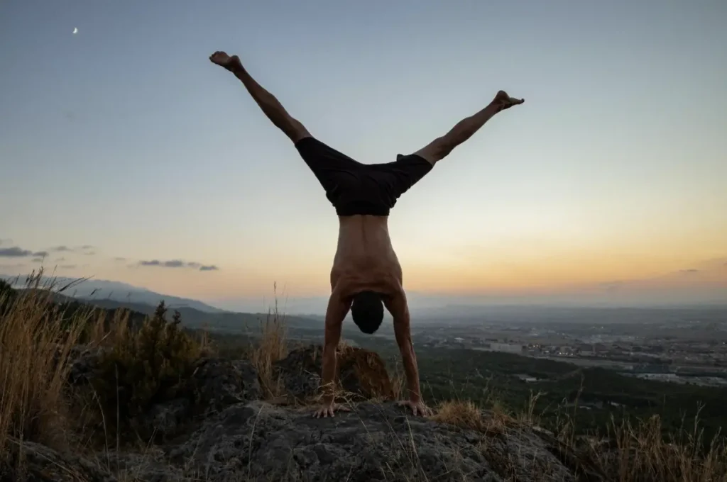 a person doing hand stand